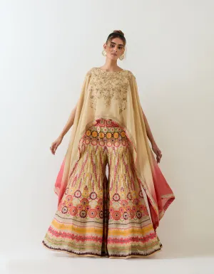 Tissue chanderi dupatta cape embellshed with intricate hand embroidery paired with organza cross stitch embroidered sharara pants