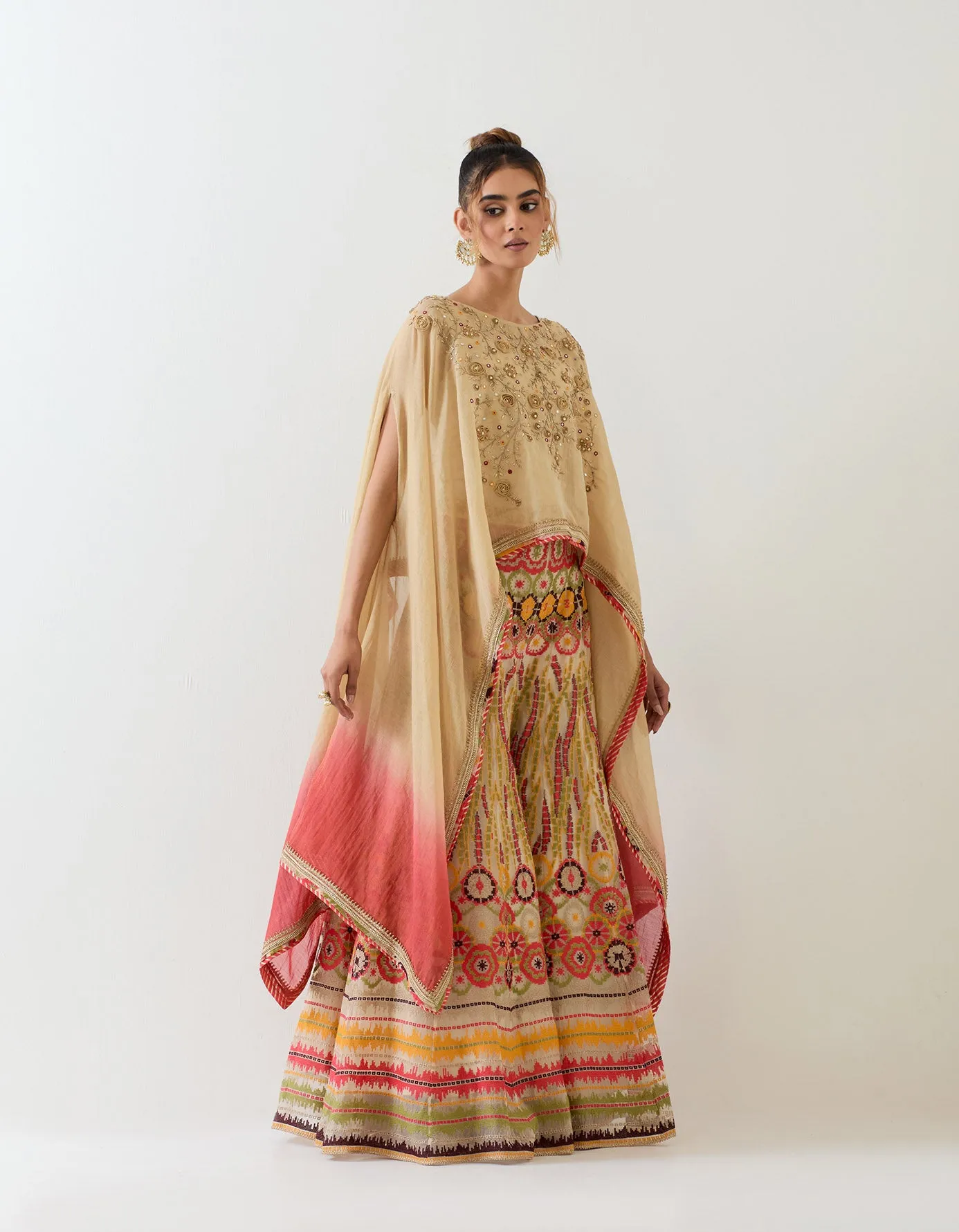 Tissue chanderi dupatta cape embellshed with intricate hand embroidery paired with organza cross stitch embroidered sharara pants