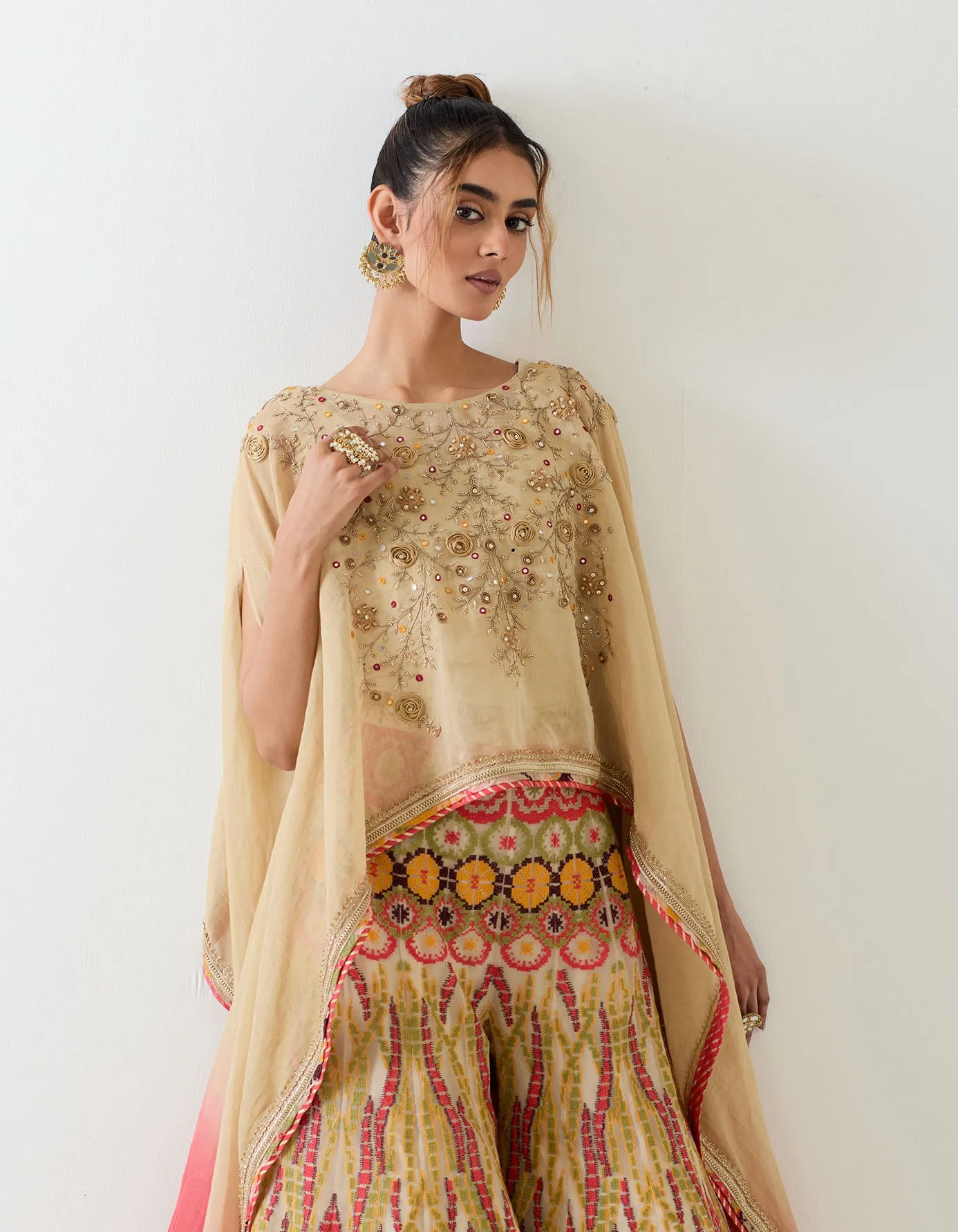 Tissue chanderi dupatta cape embellshed with intricate hand embroidery paired with organza cross stitch embroidered sharara pants